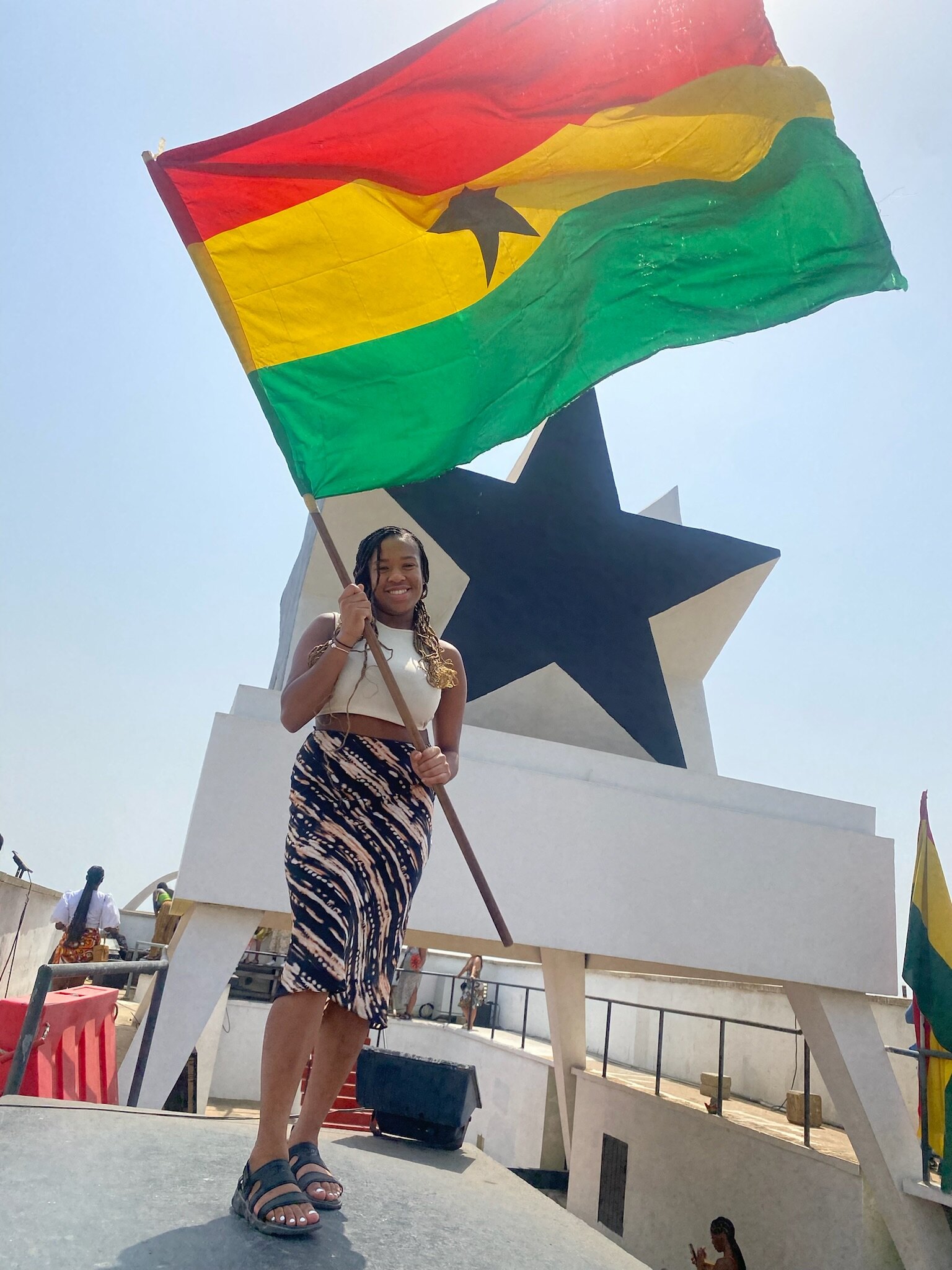 Traveler holding Ghana flag